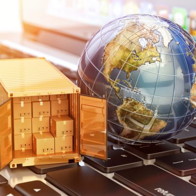 Global freight transportation business, cargo container with cardboard boxes and Earth globe on laptop